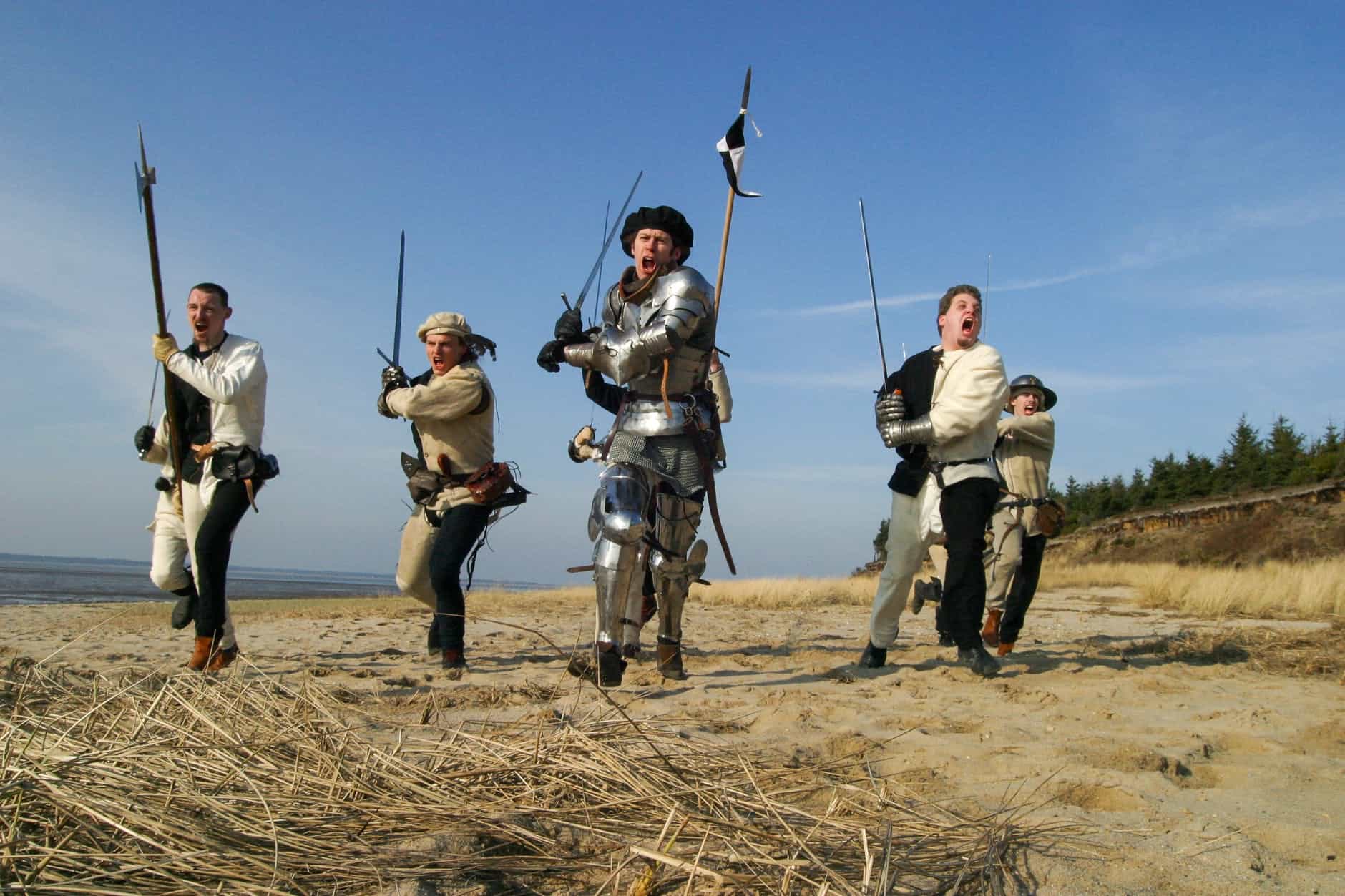 photo of men holding weapons