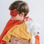 boy and a dog wearing costume