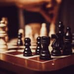 black and white chess pieces on chess board